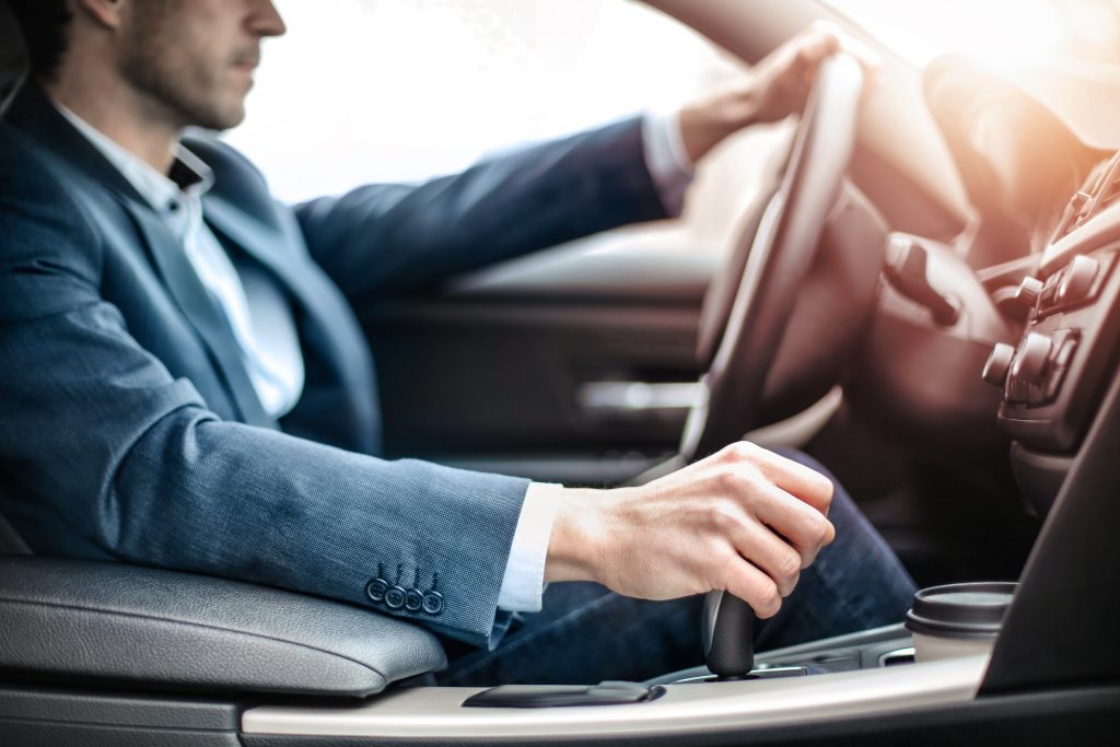 guy holding car knob